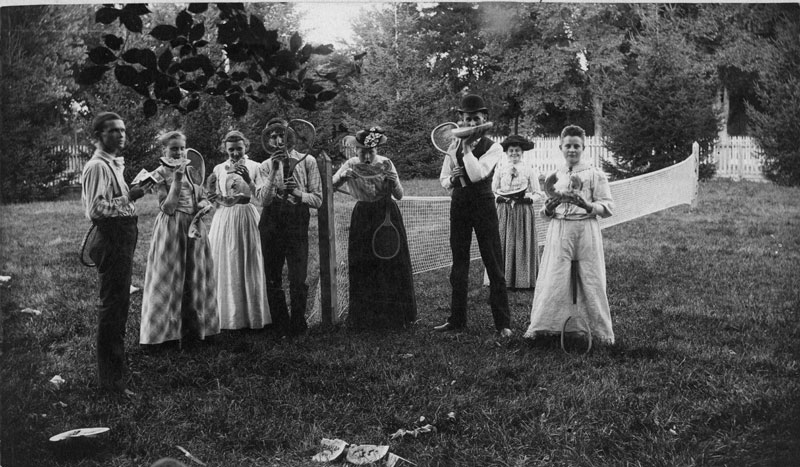 Old photo of backyard badminton and watermelon