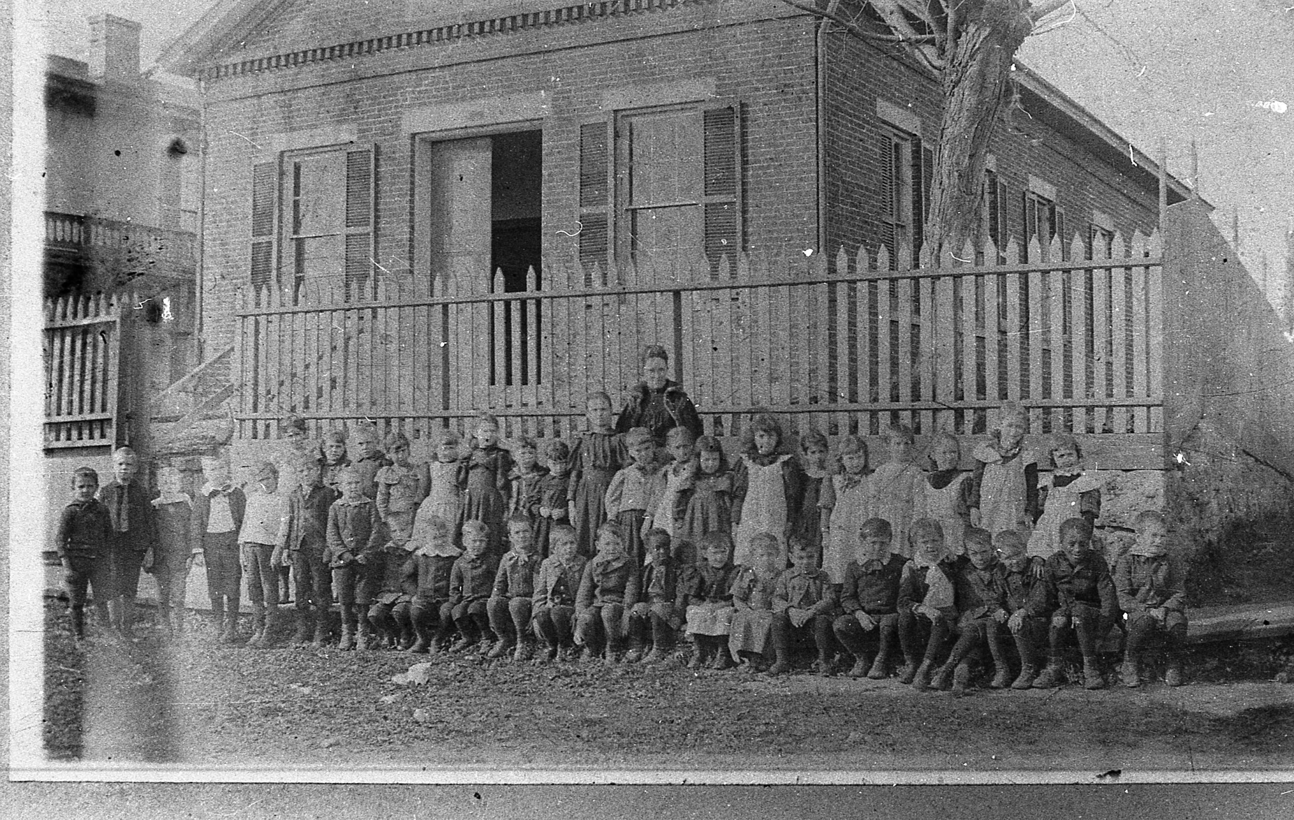 Miss Margaret Gardner with one of her classes of first graders.